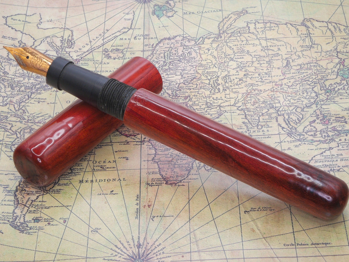 Redheart handmade fountain pen shown open with cap and rose-gold-plated nib